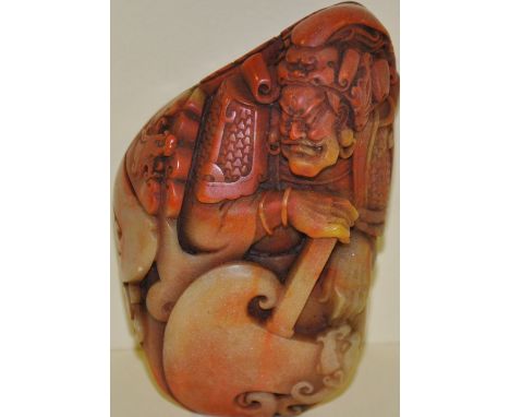 A Chinese soapstone carving of a crouching warrior with wide blade axe, H:10cm
