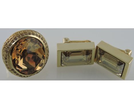A Noemi Swarovski smoke topaz magic crystal ring and ear clips, (2)