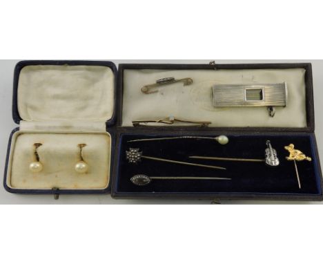 An Edwardian opal set 9 carat gold bar brooch together with a 9 carat diamond set brooch, assorted stick pins, a silver cigar