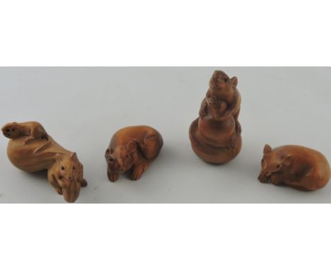 4 assorted carved hardwood netsuke, modelled as mice