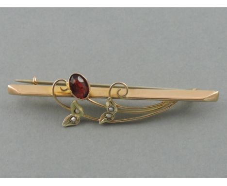 An Edwardian 9ct gold ruby and seed pearl set bar brooch