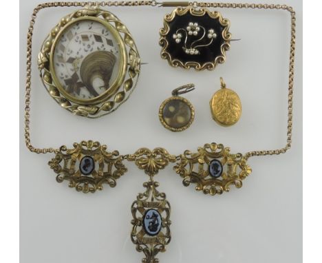A Victorian yellow metal black enamel and seed pearl memorial brooch together with 2 pinchbeck memorial brooches, an oval por