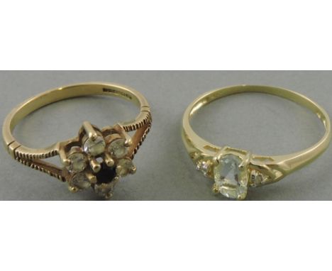 A 9ct gold sapphire and diamond cluster ring together with a 9ct gold aquamarine and diamond ring