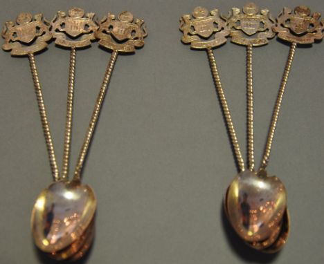 A set of six early/mid 20th Century Malaysia silver plated tea spoons, with twisted stems bearing shield crest to handles (6)