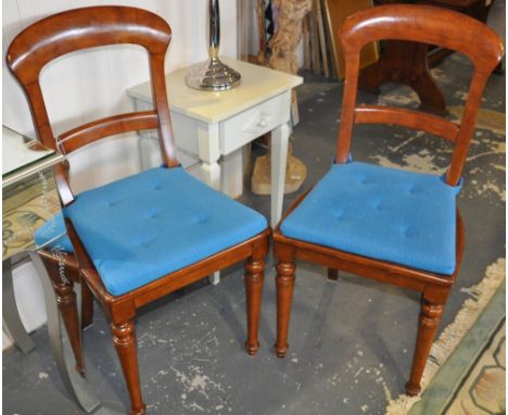 A set of 4 reproduction Victorian design walnut dining chairs with caned squab cushion seats on turned tapered legs