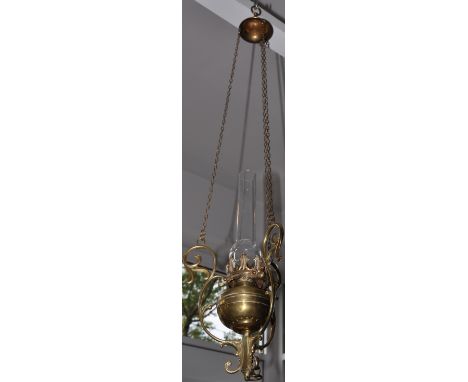 An early 20th Century Benson style hanging oil lamp with clear glass chimney together with a modern wall light with opaque sh
