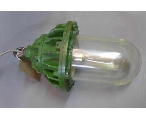 A vintage industrial ceiling light, with green top 