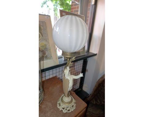 A table lamp with cherub holding light aloft and another early 20th century adjustable brass table lamp 