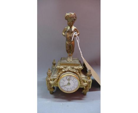 An early 20th century French gilt metal mantle clock, with faun finial, enamelled roman numeral dial 