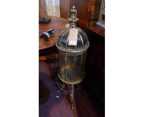 A gilt metal storm lantern, on stand, H.108cm 