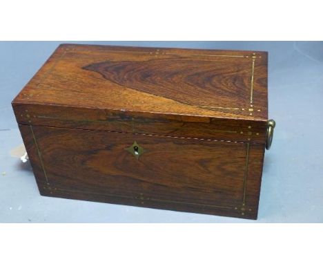 A Regency rosewood tea caddy, with brass inlay, fitted interior, red velvet lining, having twin brass handles, missing glass 