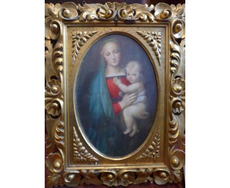 An early to mid 20th century gilt wood picture frame, carved with scrolling foliage, with print of the Mother of God and Chri