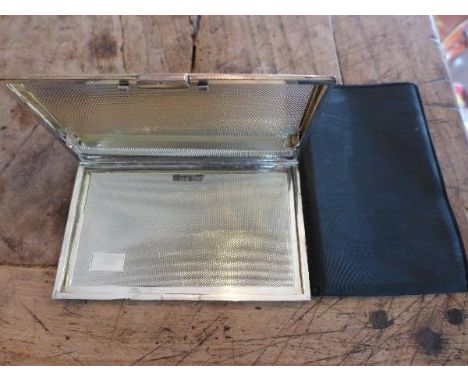 A Birmingham silver cigarette case, with engine turned design, makers initials H.C.D, dated 1972 