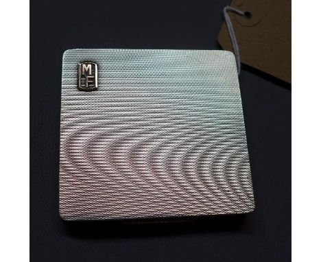 A Mappin & Webb silver cigarette case, having engine turned case and silver gilt interior, Birmingham 1937, approx. 4.3 troy 
