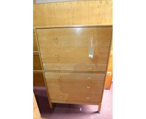 A mid 20th century light oak pedestal chest, with six drawers, raised on square legs, H.120 W.76 D.44cm 