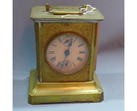 An early 20th century brass musical mantle clock 