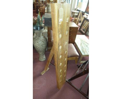 A mango wood 16 bottle floor standing wine stack, on easel support, H.150cm 