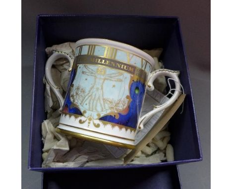 A Royal Worcester porcelain twin handled loving cup to mark the millenium numbered 199/500 in original box. 