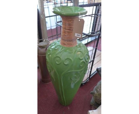 A large green glazed ceramic vase, with wicker collar, H.100cm 