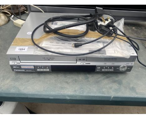 A SILVER PANASONIC DMR-ES30V DVD/VHS RECORDER WITH REMOTE CONTROL AND INSTRUCTION MANUAL 