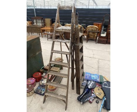 A VINTAGE SIX RUNG WOODEN STEP LADDER AND A FURTHER SIX RUNG WOODEN STEP LADDER 