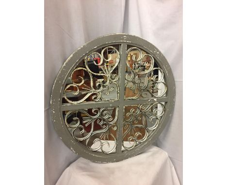 A VINTAGE STYLE DECORATIVE CIRCULAR MIRROR 