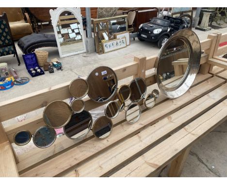 A CIRCULAR WALL MIRROR AND A FURTHER ABSTRACT WALL MIRROR 