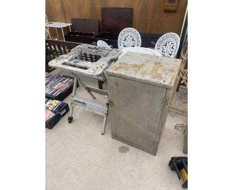 A METAL STORAGE CUPBOARD AND AN ELEKTRA BECKUM FOLDING BENCH 