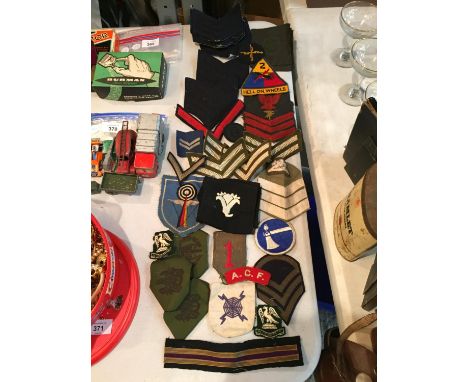 TWO TUBS CONTAINING MIXED ARMY BADGES ETC. 