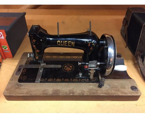 A VINTAGE 'QUEEN' SEWING MACHINE 