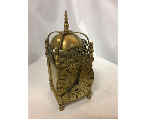 A VINTAGE BRASS LANTERN CLOCK MARKED 'EMPIRE MADE IN ENGLAND 264' 