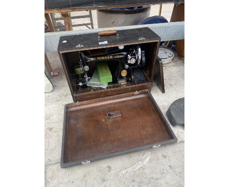 A VINTAGE SINGER SEWING MACHINE WITH CARRY CASE 