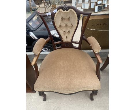 AN EDWARDIAN MAHOGANY LOW OPEN UPHOLSTERED ARMCHAIR WITH BUTTON BACK 