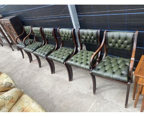 A SET OF SIX REGENCY STYLE DINING CHAIRS WITH BUTTON BACKS AND SEATS, TWO BEING CARVER 