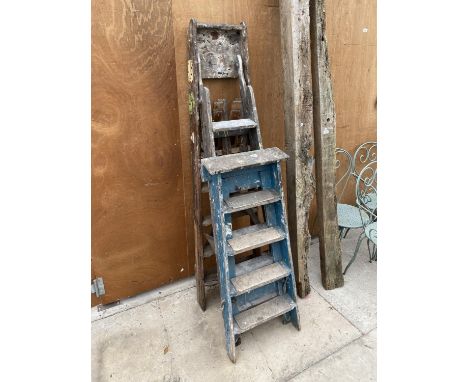 TWO FOUR RUNG WOODEN STEP LADDERS AND A FURTHER SIX RUNG WOODEN STEP LADDER 