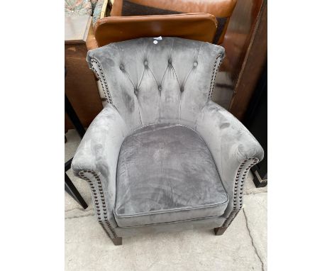 A MODERN BUTTON-BACK TUB CHAIR 