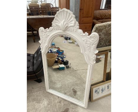 A DECORATIVE FRAMED MIRROR 