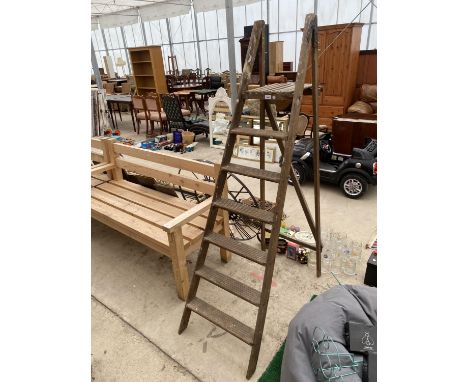 A VINTAGE SIX RUNG WOODEN STEP LADDER 
