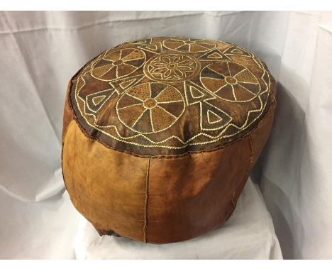 A VINTAGE LEATHER POUFFE/FOOTSTOOL 
