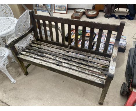 A WOODEN SLATTED GARDEN BENCH 