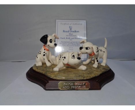 A ROYAL DOULTON DISNEYS 101 DALMATIANS 'PATCH, ROLLY AND FRECKLES' 