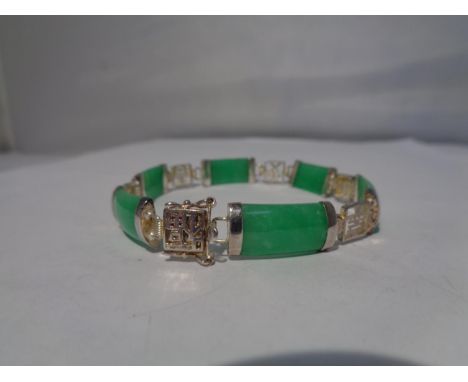 A SILVER AND JADE BRACELET 