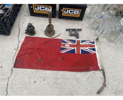 AN ASSORTMENT OF ITEMS TO INCLUDE A NAVAL RED ENSIGN, A BRASS BELL AND A BRASS TABLE LAMP ETC 