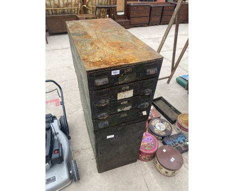 A VINTAGE METAL WORKSHOP STORAGE UNIT ENCLOSING FOUR DRAWERS AND A CUPBOARD 