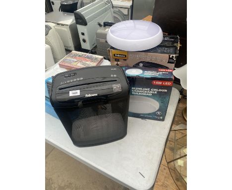 A PAPER SHREDDER AND A DOME LED LIGHT 