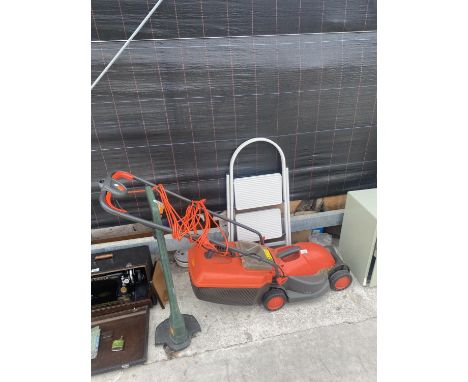 AN ELECTRIC LAWN MOWER, A SAMLL STEP LADDER AND A GRASS STRIMMER 