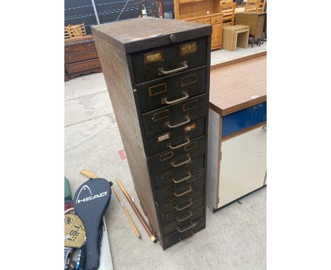 A VINTAGE 11 DRAWER METAL STORAGE UNIT 