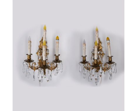 Ornate four arm sconce embellished with drop crystals. Twist switch controls lighting. Ready to mount on the wall with electr