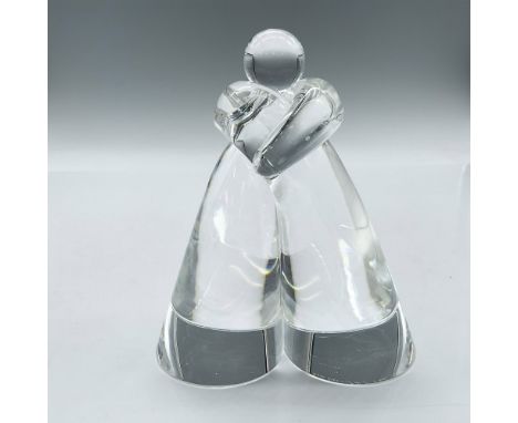 Limited edition clear glass sculpture in embrace. Steuben SHS etched mark. Issued: 20th centuryDimensions: 4"L x 2.25"W x 4.7