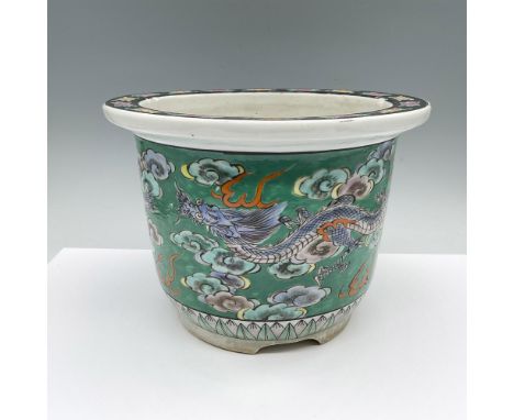 A hand painted Chinese planter inspired by Japanese culture. Depicts a three-clawed dragons, which are known in Japan, soarin